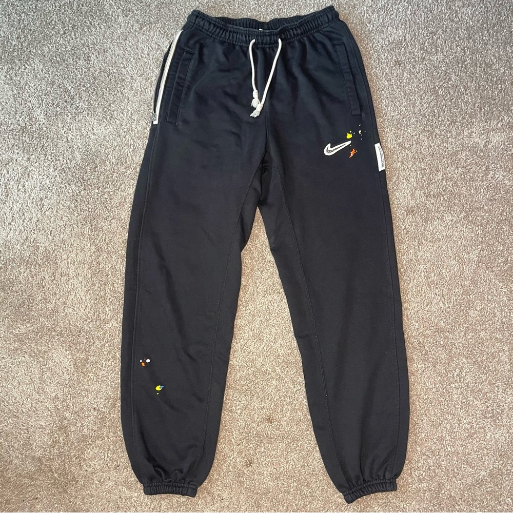 Nike Black Splash Standard Issue Sweatpants with White and Yellow Accents